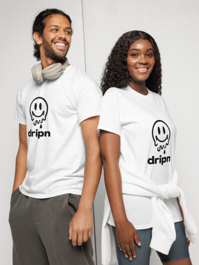Two smiling people stand back to back in white shirts with a ghost logo, one wearing beige headphones.
