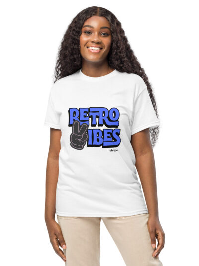 Smiling woman wearing a white T-shirt with a blue 'RETRO VIBES' graphic and a peace-sign hand illustration, visible from the waist up.